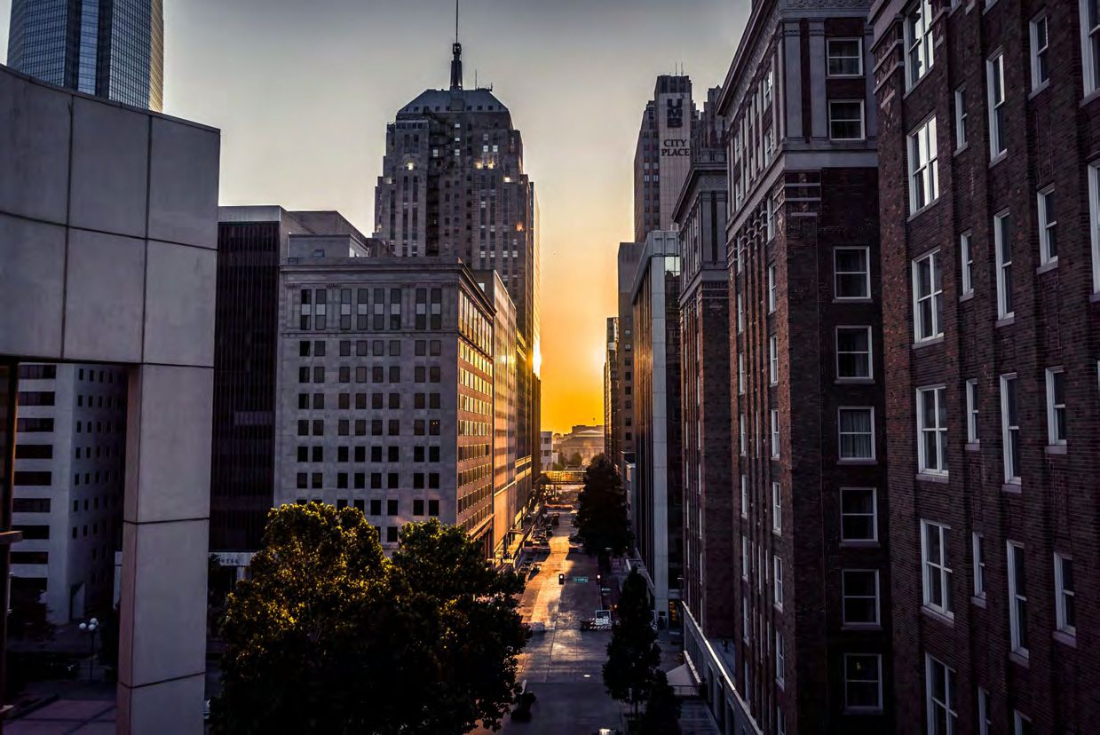 Urban sunset through city skyscrapers